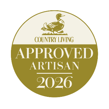 Round badge with 'Country Living Approved Artisan 2026' text and a duck illustration on a white background.