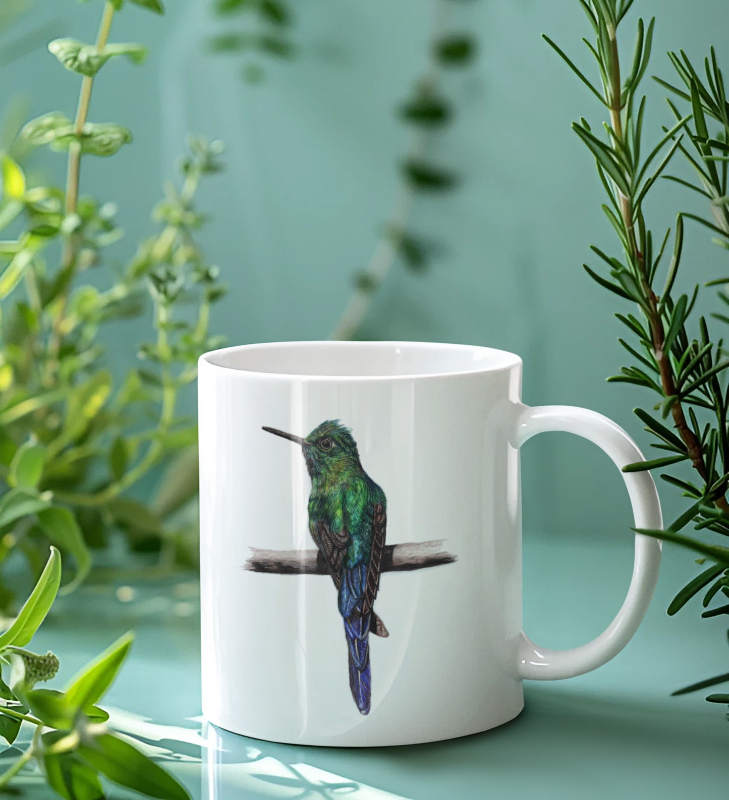 White mug with a bird design on a light green background with plants