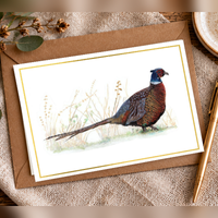 Pheasant A6 landscape greeting card by Art by Jay — flat lay mockup