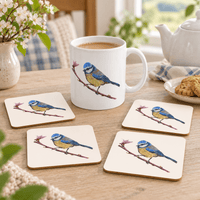 Little Blue Blue Tit mug and four matching coasters in a cosy tea-time setting